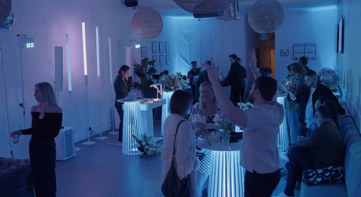 Small event venue in Costa Mesa arranged for a cocktail-style gathering with high-top tables and open space for networking